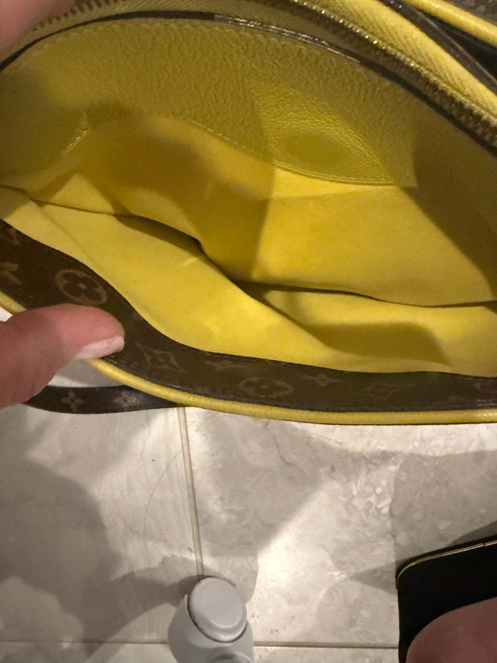 Louis Vuitton Pallas in the Monogram canvas with a yellow/saffron color accent and lining.